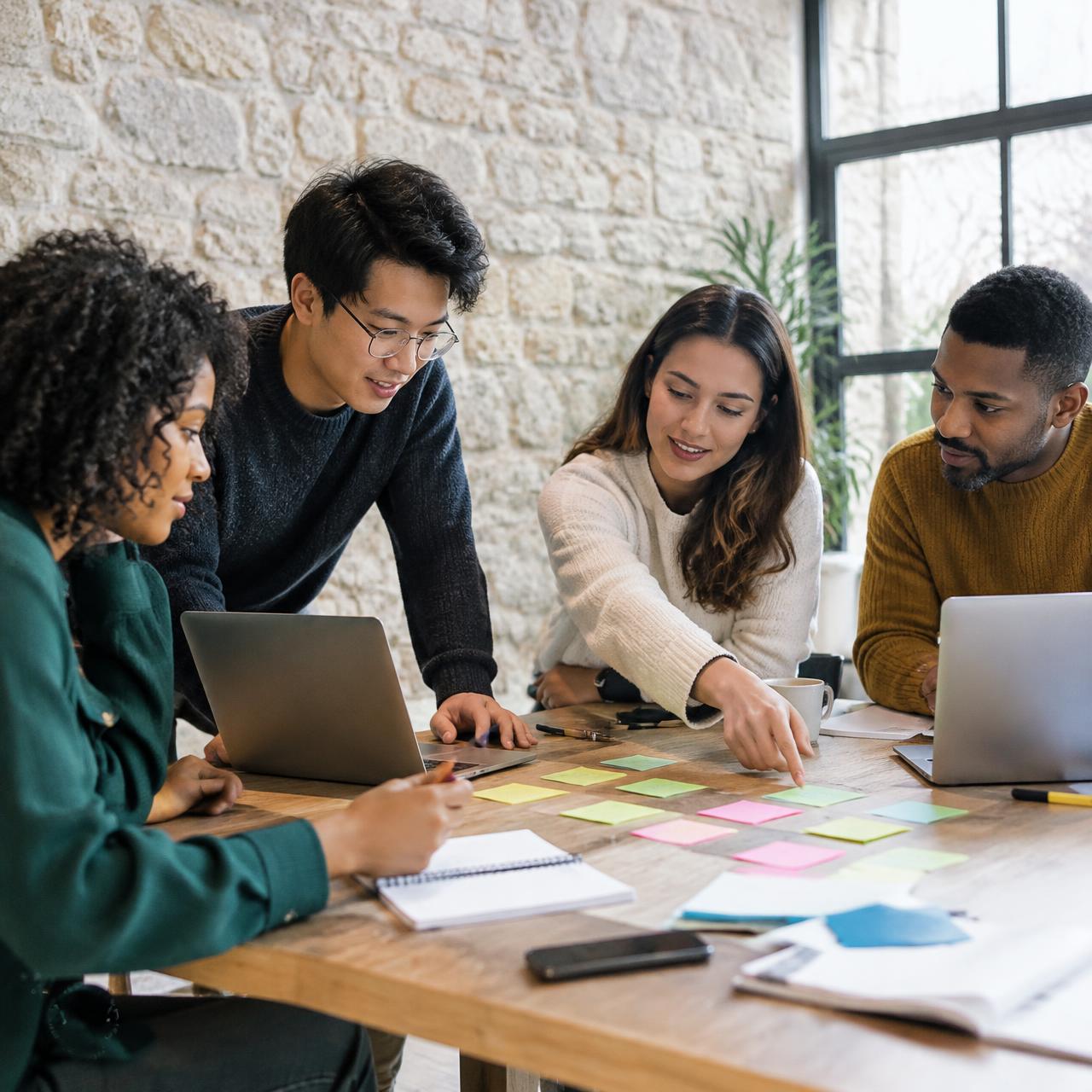 Young people collaborating around a table